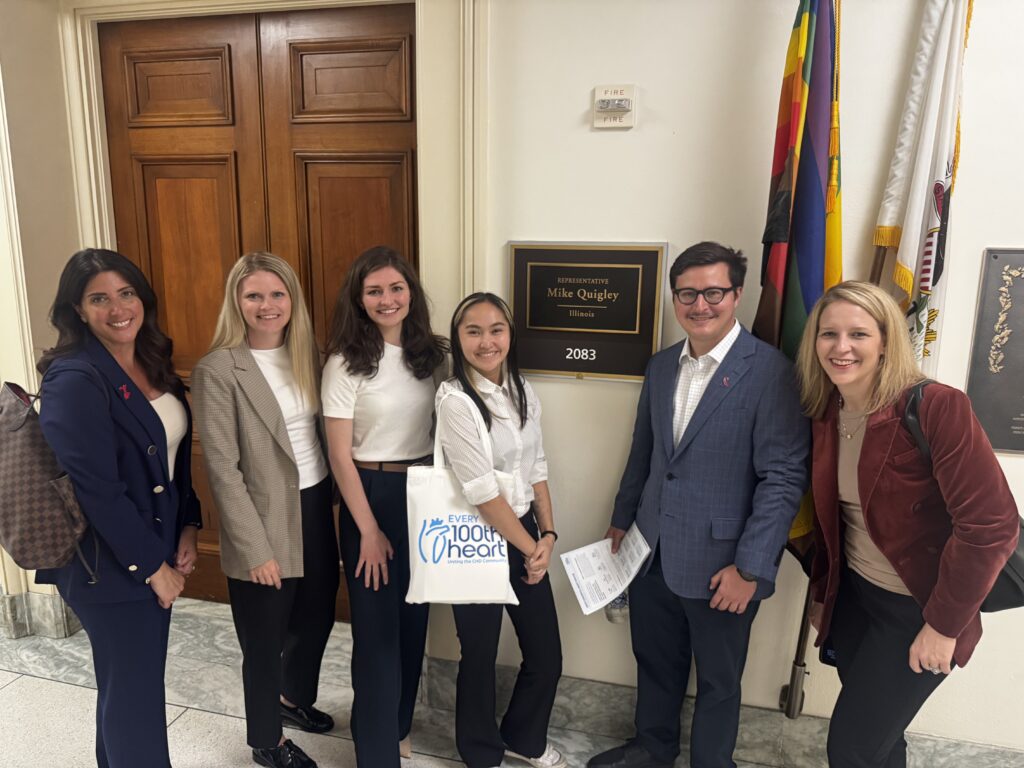 Group of advocates posing outside the congressional office of Representative Mike Quigley of Illinois