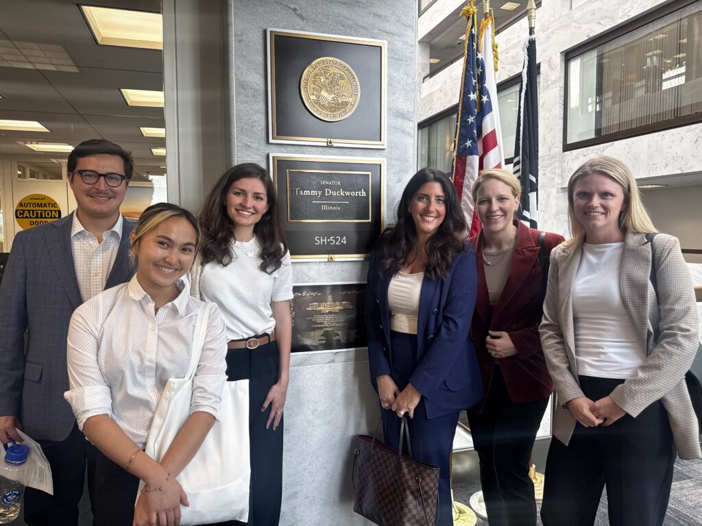 Group of advocates posing outside the office of Senator Tammy Duckworth of Illinois